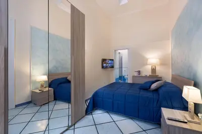 Letto o letti in una camera di Residenza Santa Lucia a Mare