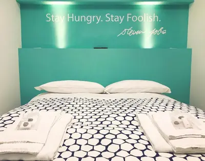 Letto o letti in una camera di St. Teresa Museum Suites