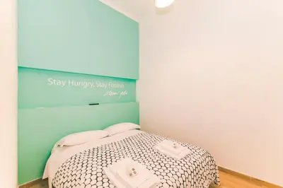 Letto o letti in una camera di St. Teresa Museum Suites