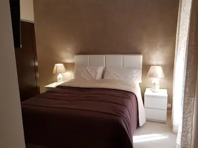 Letto o letti in una camera di Napoli Royal Flats