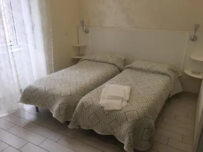 Letto o letti in una camera di Albergo Oasi