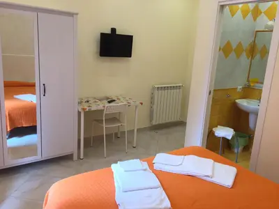 Letto o letti in una camera di Albergo Oasi