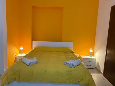 Letto o letti in una camera di B&B LA CONIGLIERA