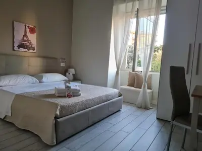 Letto o letti in una camera di ESPOSITO PLAZA- ROOMS & SUITE