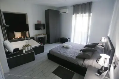 Letto o letti in una camera di ESPOSITO PLAZA- ROOMS & SUITE