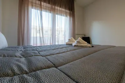 Letto o letti in una camera di Mayfair Lifestyle Suites by Babylon Stay