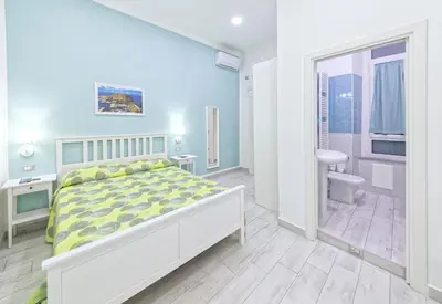 Letto o letti in una camera di B&B Rest a Napoli
