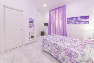 Letto o letti in una camera di B&B Rest a Napoli
