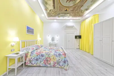 Letto o letti in una camera di B&B Rest a Napoli