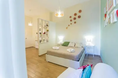 Letto o letti in una camera di Casetta Partenopea Holiday House