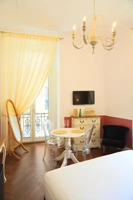 TV o dispositivi per l'intrattenimento presso Macchiato Suites Boutique Guest House