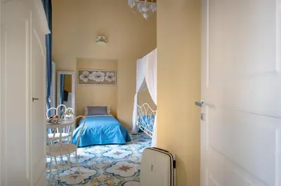 Letto o letti in una camera di Regina Elena