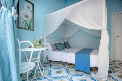 Letto o letti in una camera di Regina Elena
