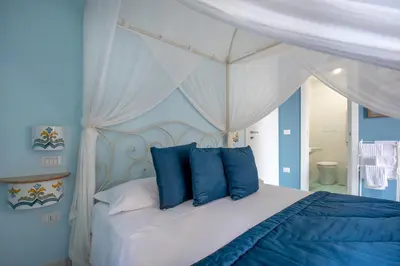 Letto o letti in una camera di Regina Elena
