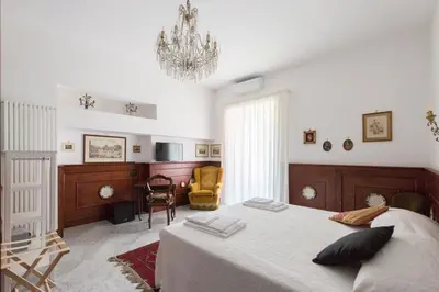 Letto o letti in una camera di Palazzo Doria d'Angri Suites