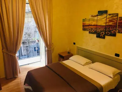 Letto o letti in una camera di B&B Alloggio Maria