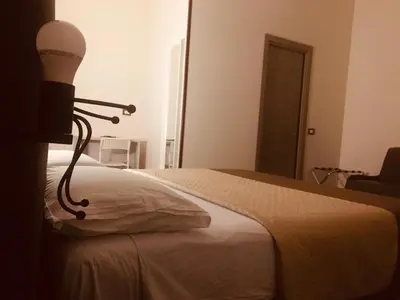Letto o letti in una camera di B&B Alloggio Maria