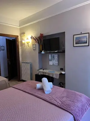 Letto o letti in una camera di B&B La Dimora Di Nettuno