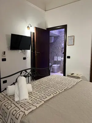 Letto o letti in una camera di B&B La Dimora Di Nettuno