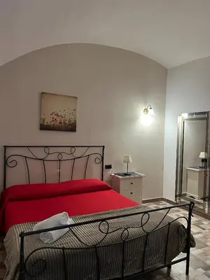 Letto o letti in una camera di B&B La Dimora Di Nettuno