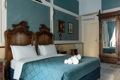 Letto o letti in una camera di Carafa di Maddaloni Residenza di Charme