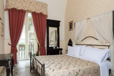 Letto o letti in una camera di Carafa di Maddaloni Residenza di Charme