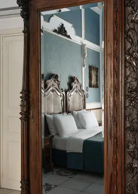Letto o letti in una camera di Carafa di Maddaloni Residenza di Charme