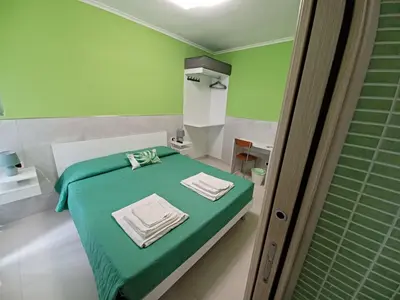 Letto o letti in una camera di B&B Quattro Palazzi Napoli Centro