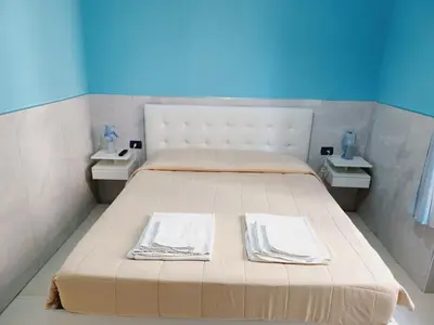 Letto o letti in una camera di B&B Quattro Palazzi Napoli Centro