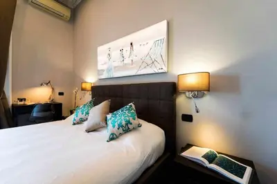 Letto o letti in una camera di Seaside Caracciolo