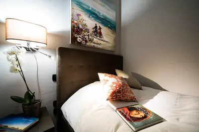 Letto o letti in una camera di Seaside Caracciolo