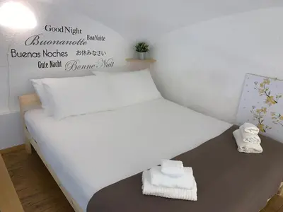 Letto o letti in una camera di Little Dream Residenza - Napoli