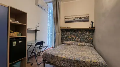 Letto o letti in una camera di B&B Napoli Plebiscito