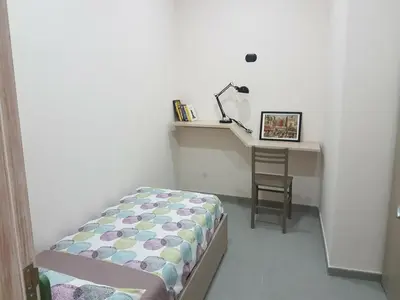 Letto o letti in una camera di Street House