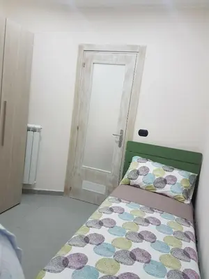 Letto o letti in una camera di Street House