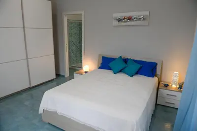 Letto o letti in una camera di Casa del Porto al Borgo Marinari