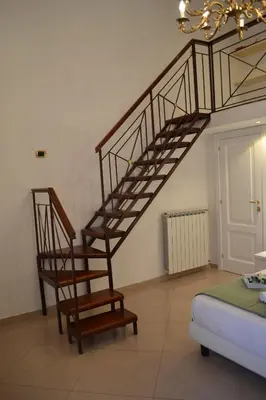 Letto o letti in una camera di Dimora Real Maria