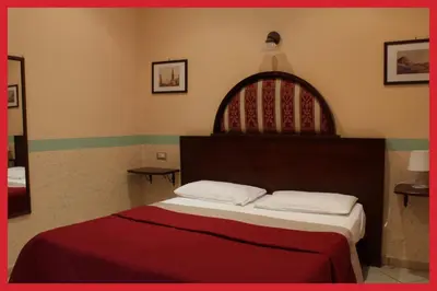 Letto o letti in una camera di B&B La Storia Di Napoli