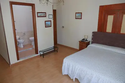 Letto o letti in una camera di B&B Domus Gemi