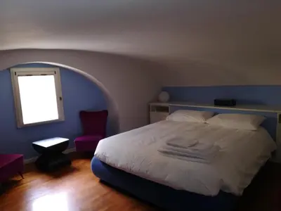 Letto o letti in una camera di Casa Mergellina
