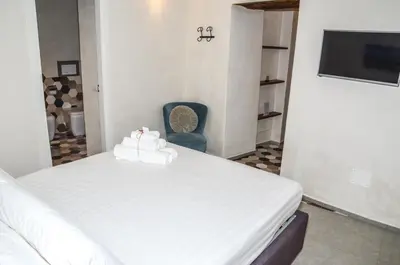 Letto o letti in una camera di Vicoli di Napoli B&B