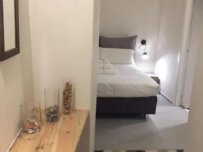 Letto o letti in una camera di Vicoli di Napoli B&B