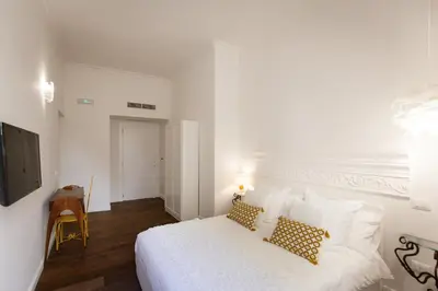 Letto o letti in una camera di Domus San Severo