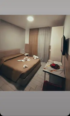 Letto o letti in una camera di Neapolis center