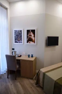 TV o dispositivi per l'intrattenimento presso 50 SUITE Guesthouse