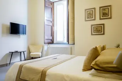 Letto o letti in una camera di Palazzo Toledano