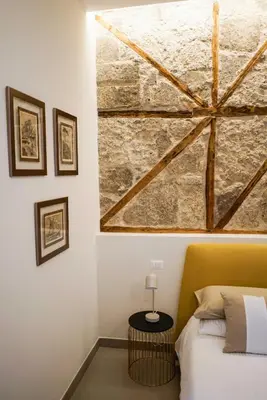Letto o letti in una camera di Palazzo Toledano