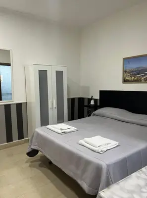 Letto o letti in una camera di Casa vacanza Da Totore
