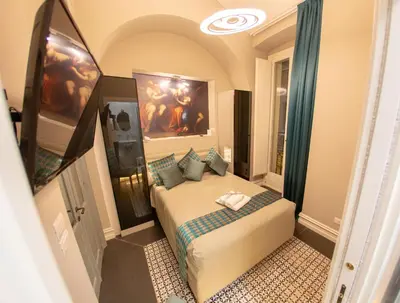 Letto o letti in una camera di Leone Camere D'autore - CHIAIA