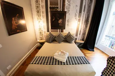 Letto o letti in una camera di Leone Camere D'autore - CHIAIA